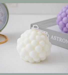 Detail of creative bubble cube scented candles in white and purple geometric shapes