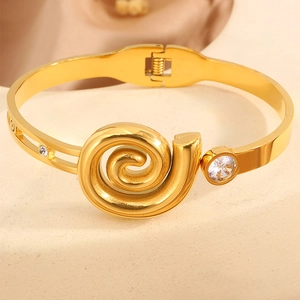 Elegant gold spiral relief bangle with sparkling zircon inlay in luxury vintage style