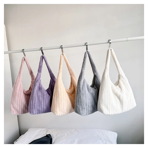 Faux fur shoulder bags in pink, purple, beige, gray, and white displayed on a rack
