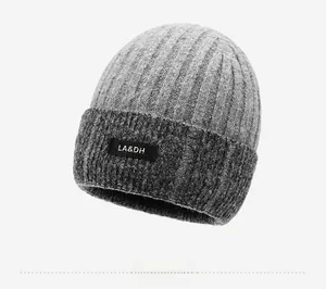 Close-up of knit winter hat featuring thick ribbed texture and LA&DH woven label