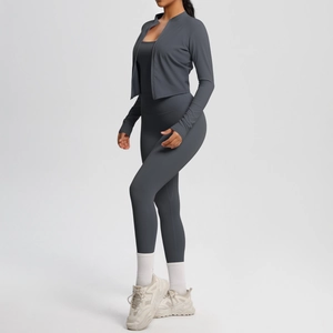 Three-piece yoga set with dark grey zip jacket, tank top, and high-waisted leggings