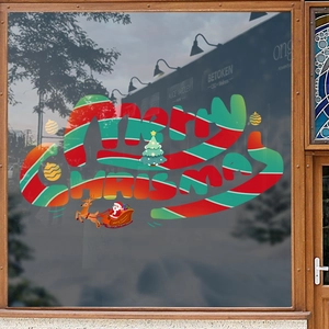 Christmas window decals with Merry Christmas lettering, Santa sleigh, and festive trees
