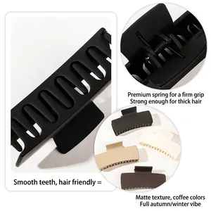 Matte square hair claw clips in earth tones showing rounded teeth and metal spring
