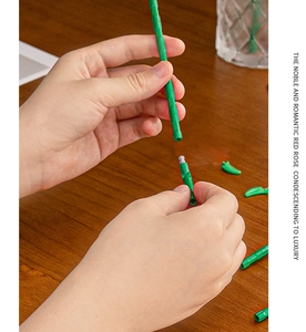 Detailed close-up of green flower stem assembly process for building block rose