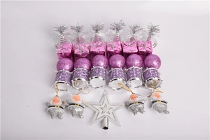 Detail of Christmas tree ornaments set including purple bells, gift boxes and glitter baubles