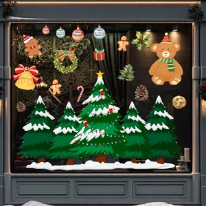 Dettaglio di adesivi natalizi in PVC per vetrine con Babbo Natale e omini di pan di zenzero