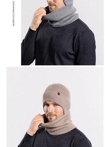 Detail view of winter knitted beanie and neck warmer set with thick ribbed texture