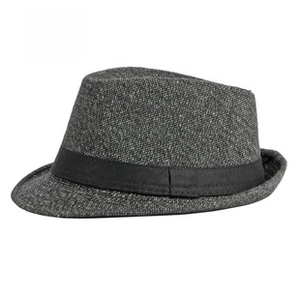 Detailed close-up of dark grey fedora hat featuring textured wool and black ribbon band