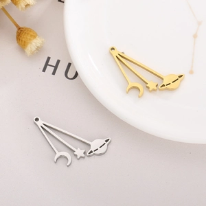 Polished stainless steel celestial charms with moon, star and saturn motifs in gold and silver