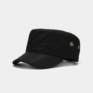 Close-up of black cadet cap featuring metal ventilation eyelets and reinforced stitching