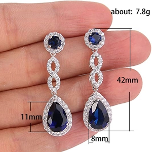Elegant silver-tone teardrop earrings with sapphire blue stones and white zircon accents