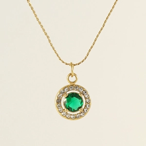 Close-up of golden titanium necklace featuring a green zircon halo water drop pendant