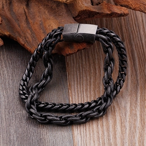 Men's double-layered stainless steel bracelet with Cuban and keel chain on a rustic wood block