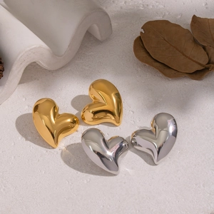 Minimalist 3D heart stud earrings in polished gold and silver stainless steel