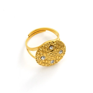 Detail of gold-plated open ring featuring a braided mesh texture and four clear zircons