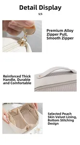 Detailed view of vertical texture, smooth gold zipper, and reinforced leather handle of cosmetic bag