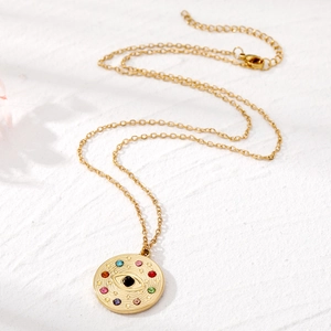 Collier bohème en acier inoxydable doré avec pendentif œil en cristal sur fond de pierre