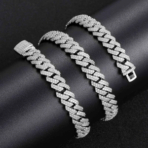 Macro detail of 10mm silver Cuban link chains with shimmering pave-set zircon stones