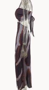 Detail view of tie-dye dress with side lace-up design and open back on a model