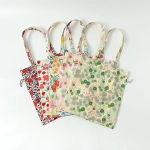 Floral print canvas tote bags for women with botanical patterns and cotton shoulder straps