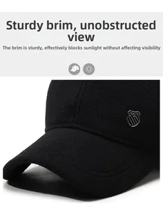 Close-up of a black winter wool baseball cap with a metal logo and structured brim