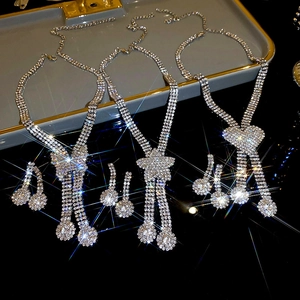 Luxury rhinestone jewelry set featuring butterfly star and heart pendants with tassels
