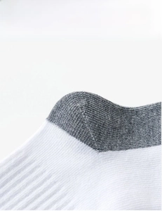 Close-up of white school sock with gray imported latex elastic cuff for high resilience