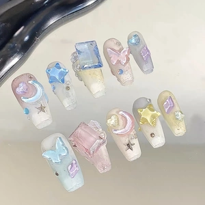 Handmade 3D aurora press-on nails with stars, moons, and pastel butterfly charms