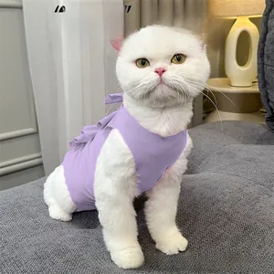 Detail view of purple cotton cat recovery suit with ruffle trim and tie-back closure