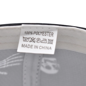 Detail shot of the internal laundry label showing 100% polyester fabric and care icons