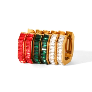 Detailed view of U-shaped stainless steel earrings with red, green and white zircon stones