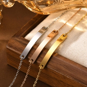 Minimalist bar bracelet in gold and silver finish on textured linen for everyday wear
