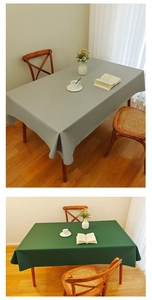 Close-up of waterproof faux leather tablecloth in grey and green options for dining tables