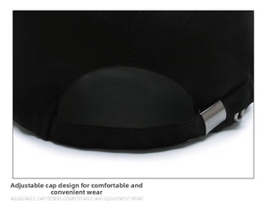 Close-up of black cotton baseball cap showing adjustable silver metal buckle detail