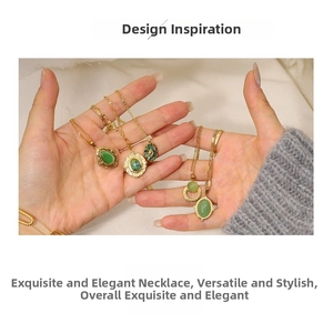 Detail of diverse vintage 18K gold plated necklaces with green oval gemstone pendants