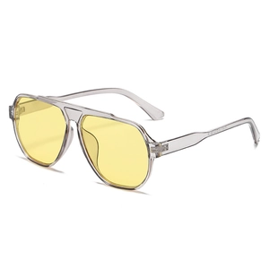 Fashionable oversized aviator sunglasses with transparent grey frame and yellow lenses