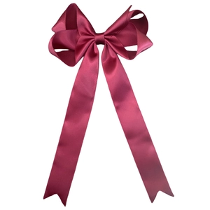 Large burgundy grosgrain ribbon hair bow with long streaming tails on white background