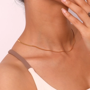 Minimalist 18K gold-plated 2mm stainless steel blade chain necklace on female model