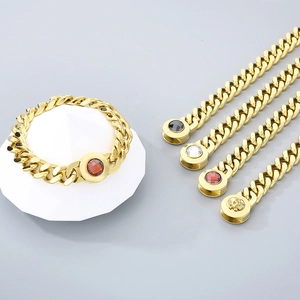 Detail of 11mm gold Cuban links with diverse skull and gemstone encrusted buckles