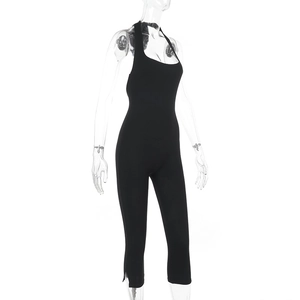 Detailed side view of black halter neck slim fit jumpsuit with chic side slit detail