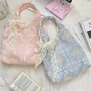 Detailed embroidery on lace tote bag with sequined bow and floral butterfly patterns