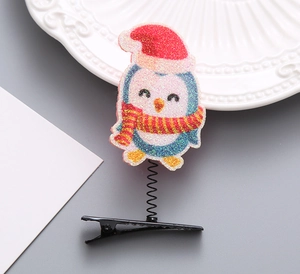 Glitzernde Weihnachts-Pinguin Haarklammer mit Feder und roter Mütze auf Metall-Clip
