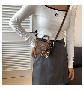 Brown PU leather mini crossbody bag with a cute bear charm and golden hardware