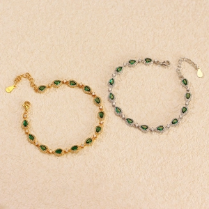 Luxurious S925 silver bracelets with emerald-green gems in gold and silver finishes