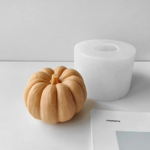 Macro detail of pumpkin silicone mold with textured candle showing realistic ribs and stem