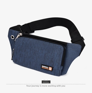 Detail view of durable navy blue nylon fabric and adjustable strap buckle on sports waist bag