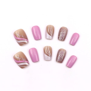 Pink and nude wavy patterned press-on nails with glitter finish on white background