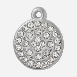 Macro shot of silver stainless steel round pendant with micro-pave clear rhinestones