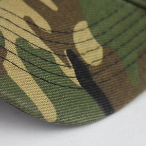 Close-up of camouflage pattern and detailed stitching on the woven fabric sun visor brim