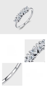 Macro detail of S925 sterling silver stamp and five heart-shaped cubic zirconia stones